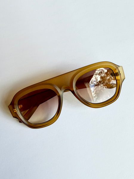 Brown aviator sunglasses on a white background